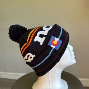 Noosa navy beanie with Colorado and pom pom